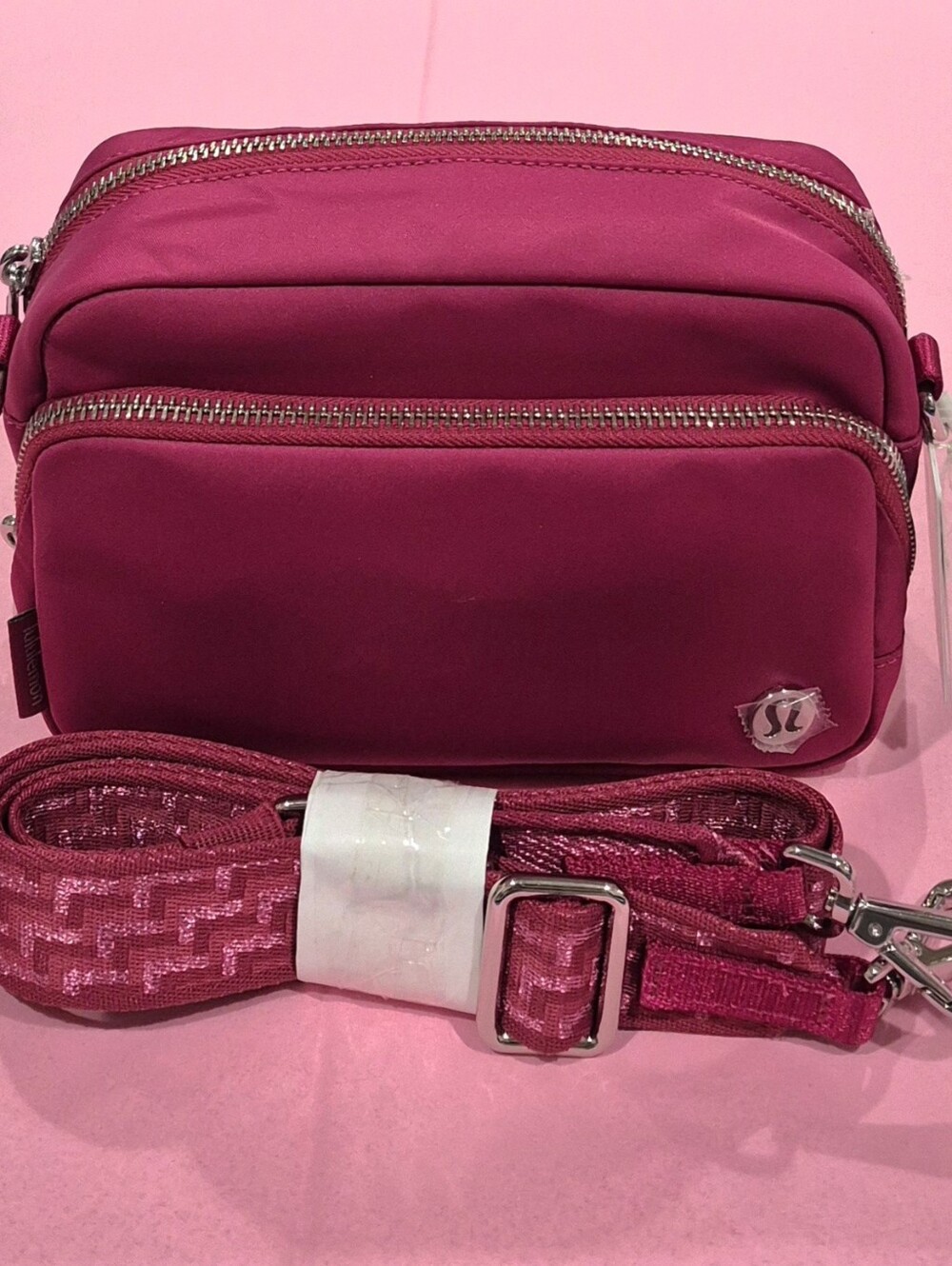 *NWT*Lululemon Raspberry Pink Metallic L- Monogram Crossbody Bag, Volume 2L.